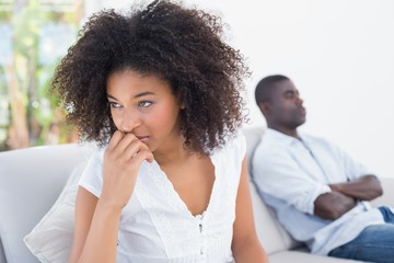 Attractive couple not talking on the couch