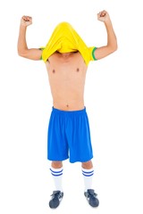 Fototapeta premium Football player in yellow celebrating a victory
