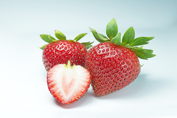 Isolated strawberries on white - Stock Image
