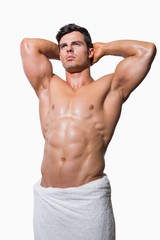 Fototapeta premium Shirtless muscular man wrapped in white towel