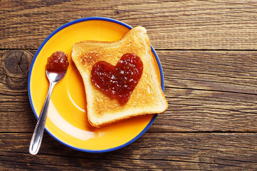 Toast bread with jam in shape of hearts