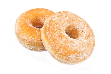 Two donuts powdered with sugar isolated on white