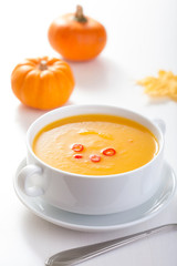 pumpkin soup in white bowl