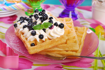 waffles with whipped cream and blueberries