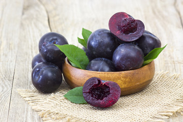 fresh plums in a bowl