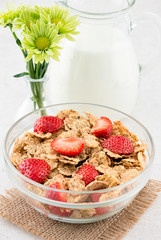 Morning breakfast with cornflakes and fresh stawberry