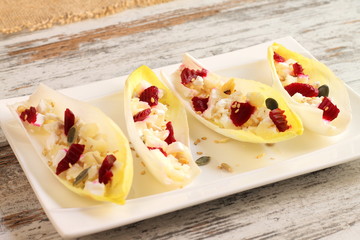 Endive or chicory salad with beetroot, goat cheese and nuts
