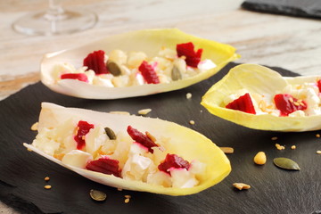 Endive or chicory salad with beetroot, goat cheese and nuts