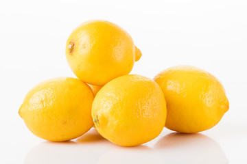 ripe lemons on a white background 