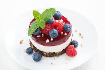 delicious cake with fruit jelly and fresh berries