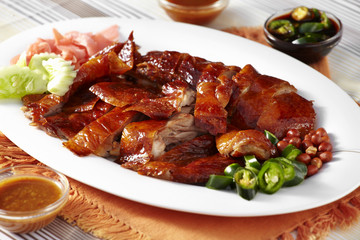 close up chinese duck and sauce in white dish