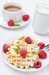 waffles with fresh raspberries and nuts for breakfast