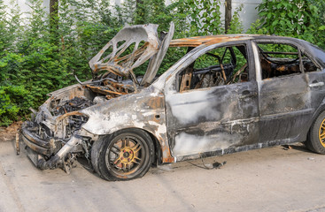 Burnt out car wreck after a fire