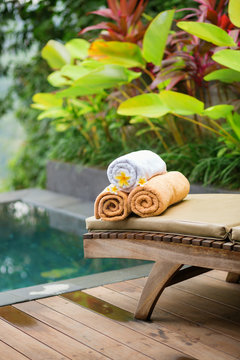 Towels with frangipani flowers in a Balinese spa