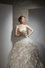 The beautiful young woman in a wedding dress