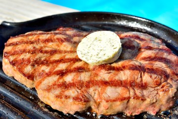 bbq a grilled steak at  the swimming pool