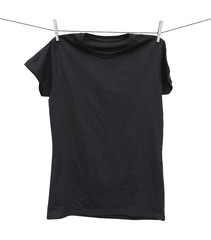 black t-shirt hanging on clothesline