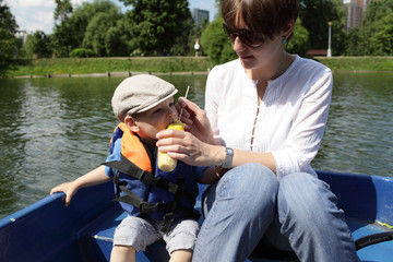 Mother with son in the boat