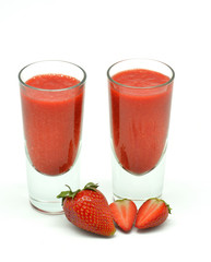 strawberry milkshake in two glasses isolated in white