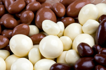 chocolate covered nuts and raisins background