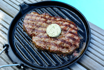 bbq a grilled steak at  the swimming pool
