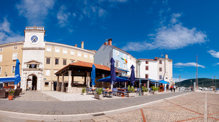 Fototapeta na wymiar Panoramic view of Frane Petrica square and clock tower in Cres