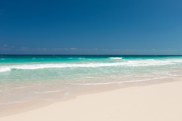 blue sea or ocean, white sand and sky