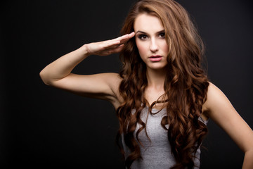Fototapeta premium beautiful girl gives salute