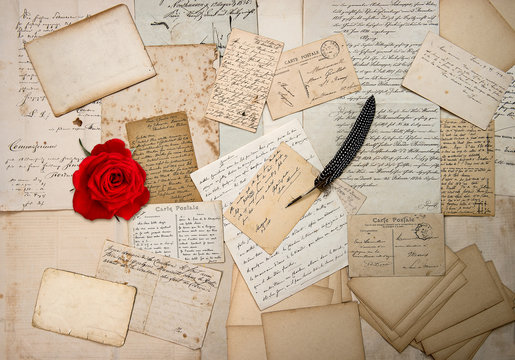 old letters, handwritings, vintage postcards and red rose