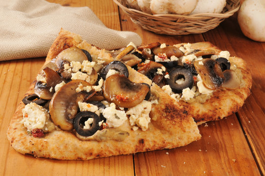 Naan bread with mushrooms and feta cheese