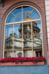 Fototapeta na wymiar Window with reflection of St Isaac Cathedral