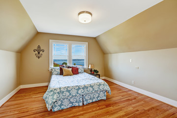 Cozy bedroom interior  with vaulted ceiling