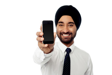 Smiling man showing his new mobile phone