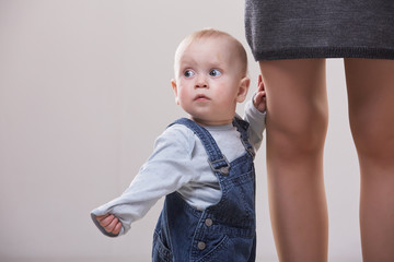 baby  between the legs of mom