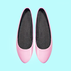 pink shoes on a blue background