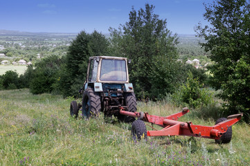 old farm tractor on the lawn in the grass