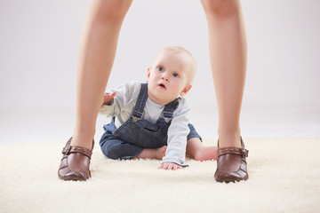 baby  between the legs of mom