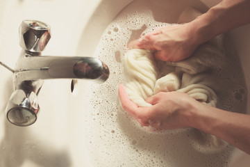Washing socks in sink - 67527345