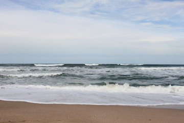 Marine landscape with sea waves and blue sky