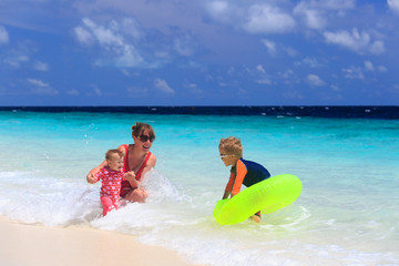 Fototapeta na wymiar mother with kids swimming on sea vacation