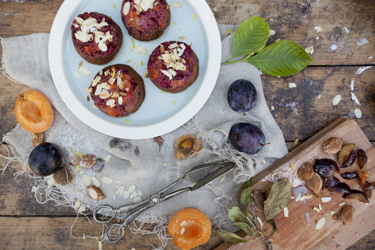 fruits vegan cupcakes with apricots and prunes on rustic table