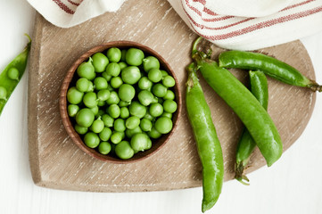 Close-up of green peas on wooden background