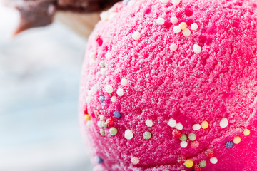 Ice cream scoops on wooden table.