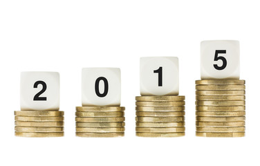 Year 2015 on Stacks of Gold Coins White Background