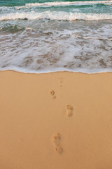 footprints on a sandy beach
