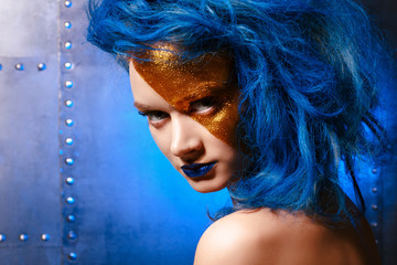 Portrait of young woman in superhero cosmetics