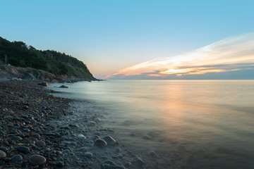 Ocean shore at a crack of dawn (Slow shutter speed)