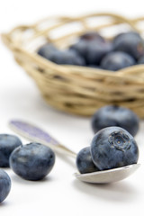 Fresh ripe blueberries on spoon closeup