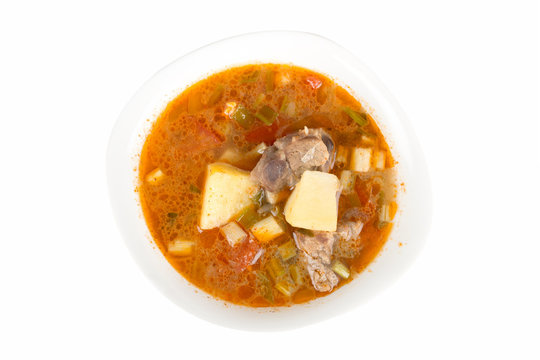 Goulash soup in a yellow bowl