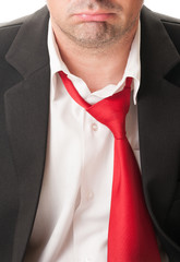 Upset business man with loose tie.